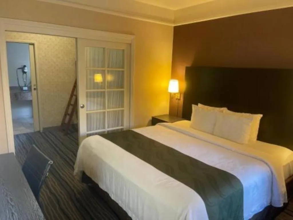 Bed in Ramada Suites by Wyndham San Diego