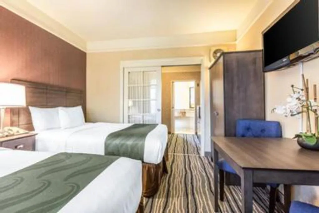 Bed in Ramada Suites by Wyndham San Diego