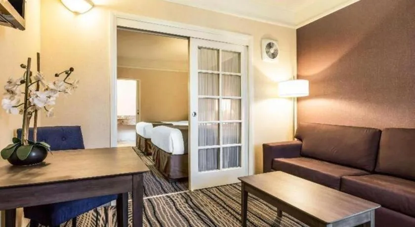 Bed in Ramada Suites by Wyndham San Diego