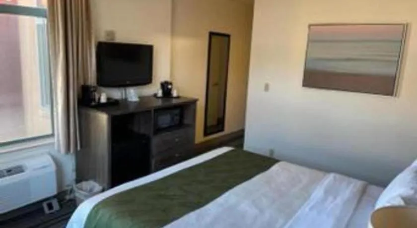 Bed in Ramada Suites by Wyndham San Diego