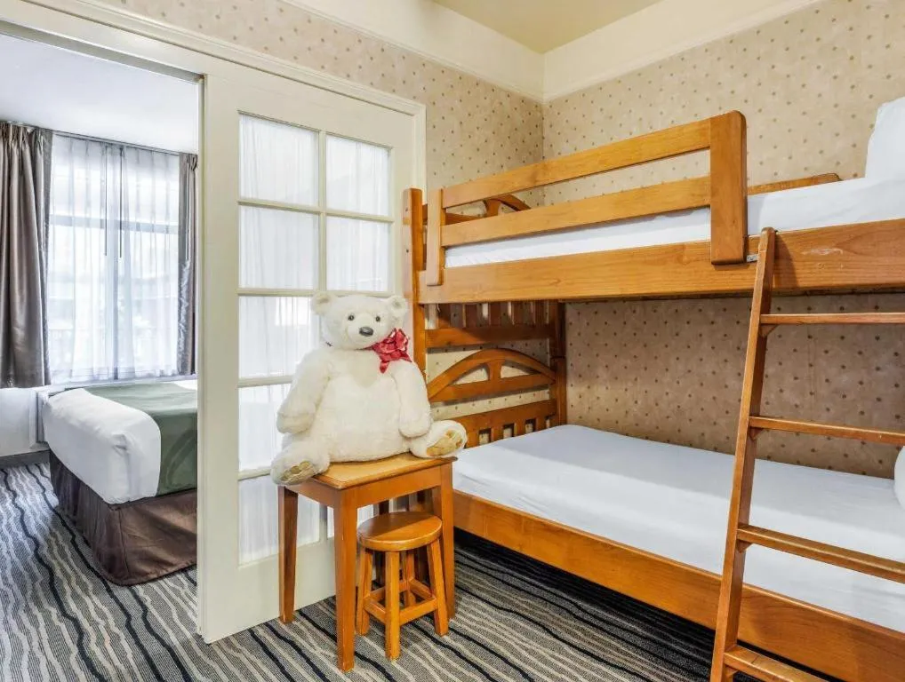 Bed in Ramada Suites by Wyndham San Diego