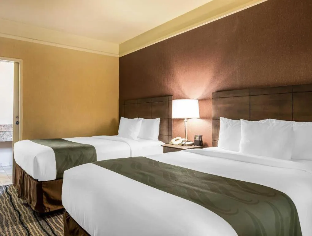 Bed in Ramada Suites by Wyndham San Diego