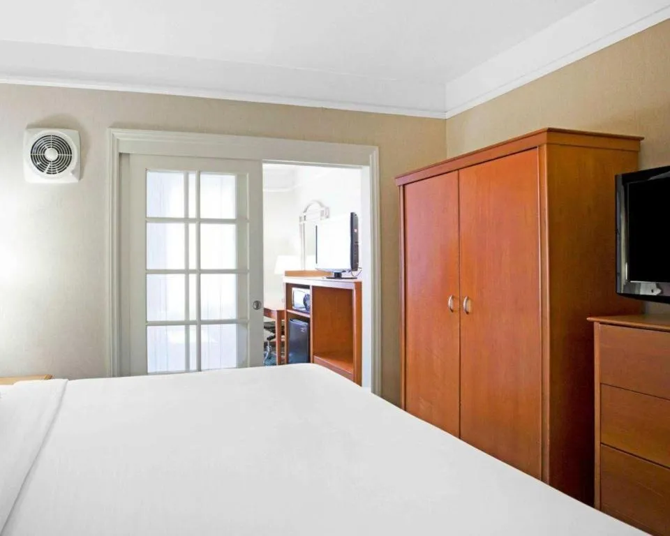 Bed in Ramada Suites by Wyndham San Diego