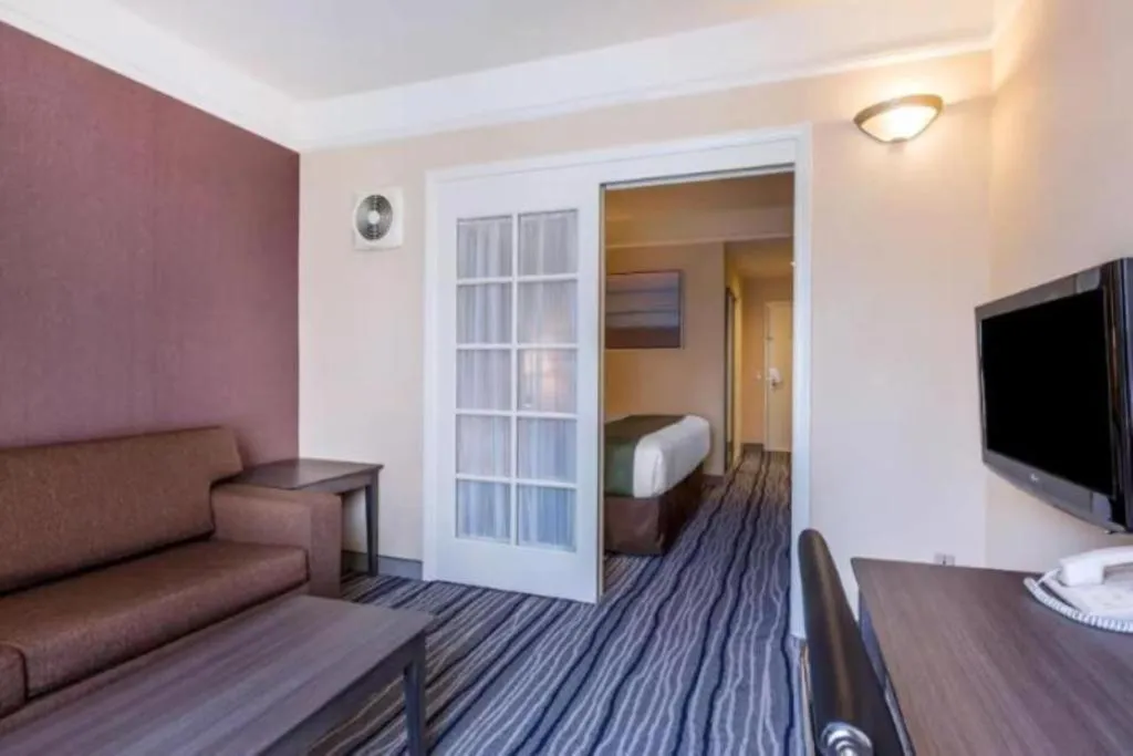 Bed in Ramada Suites by Wyndham San Diego