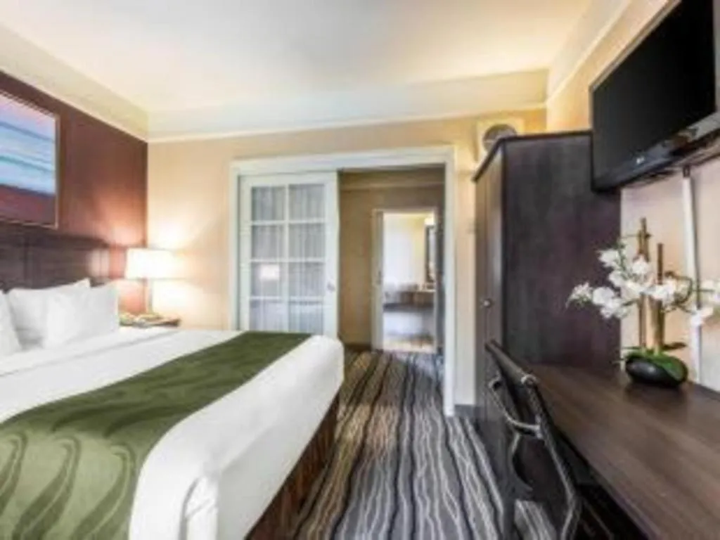 Bed in Ramada Suites by Wyndham San Diego