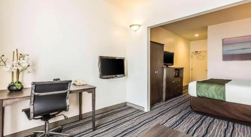 Bed in Ramada Suites by Wyndham San Diego