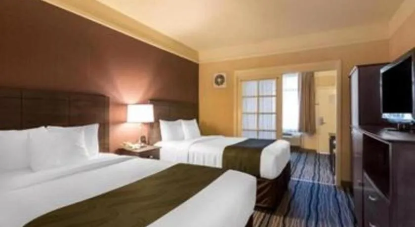 Bed in Ramada Suites by Wyndham San Diego