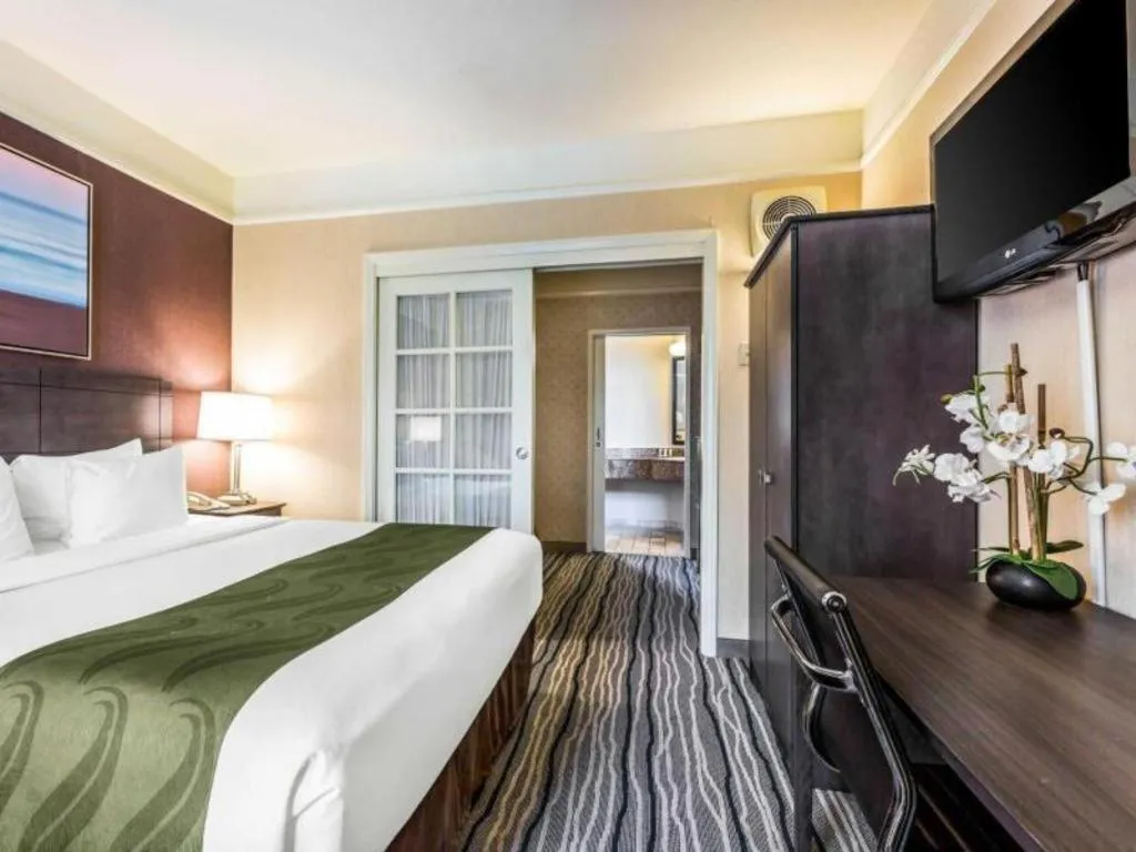 Bed in Ramada Suites by Wyndham San Diego