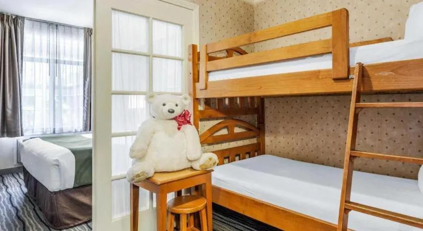 Bed in Ramada Suites by Wyndham San Diego