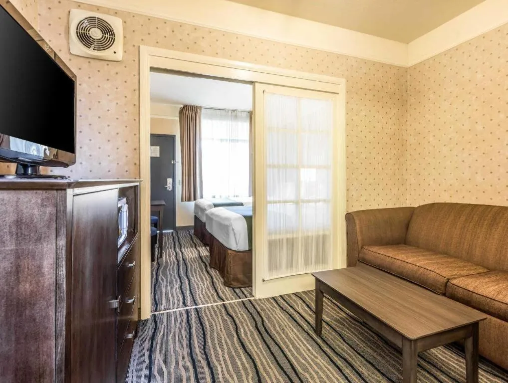 Bed in Ramada Suites by Wyndham San Diego