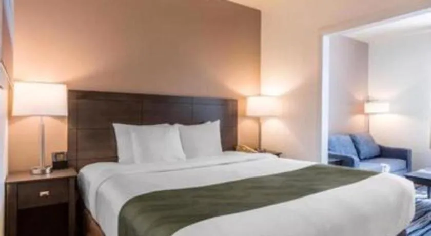 Bed in Ramada Suites by Wyndham San Diego