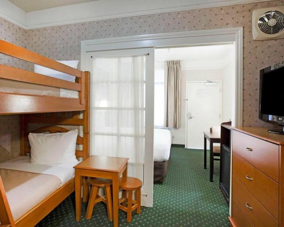 Bed in Ramada Suites by Wyndham San Diego