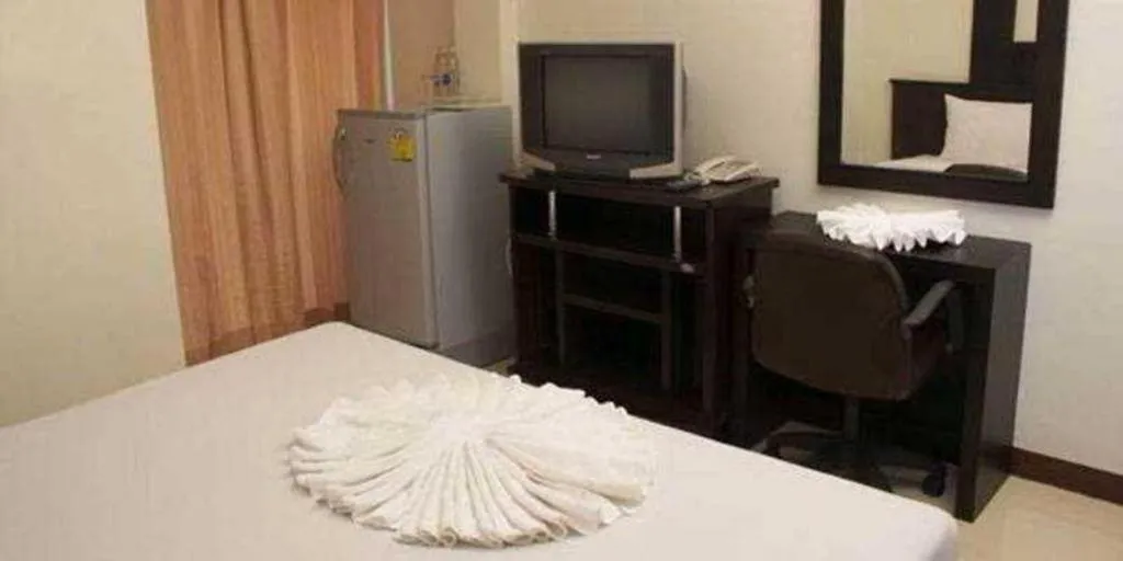 Bed in Grand Pinnacle Hotel
