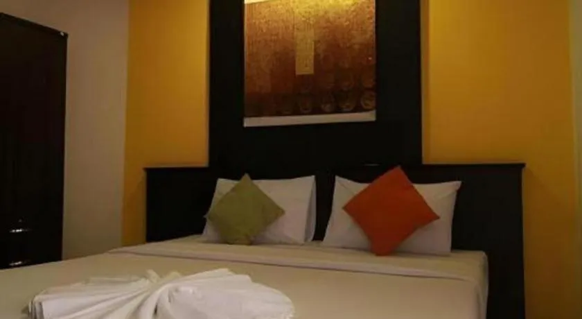 Bed in Grand Pinnacle Hotel