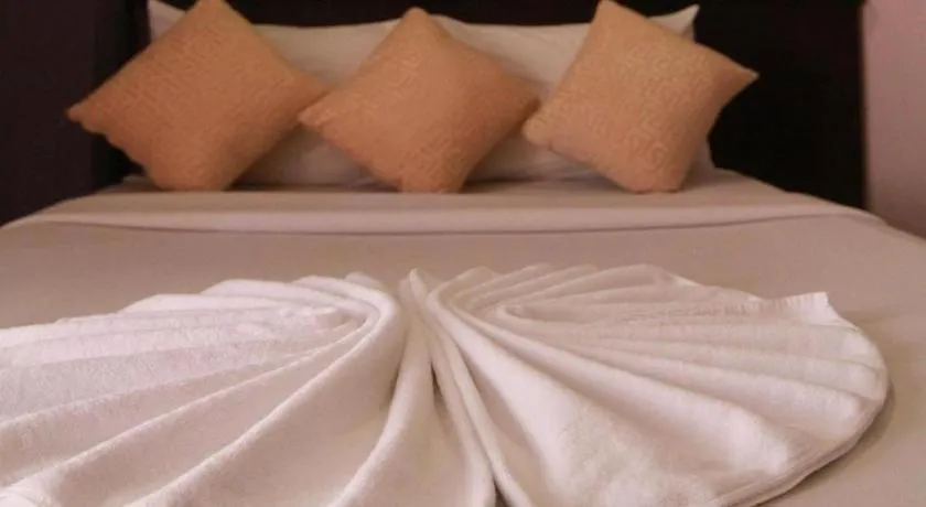 Bed in Grand Pinnacle Hotel