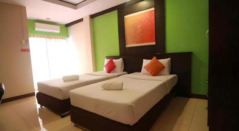 Bed in Grand Pinnacle Hotel