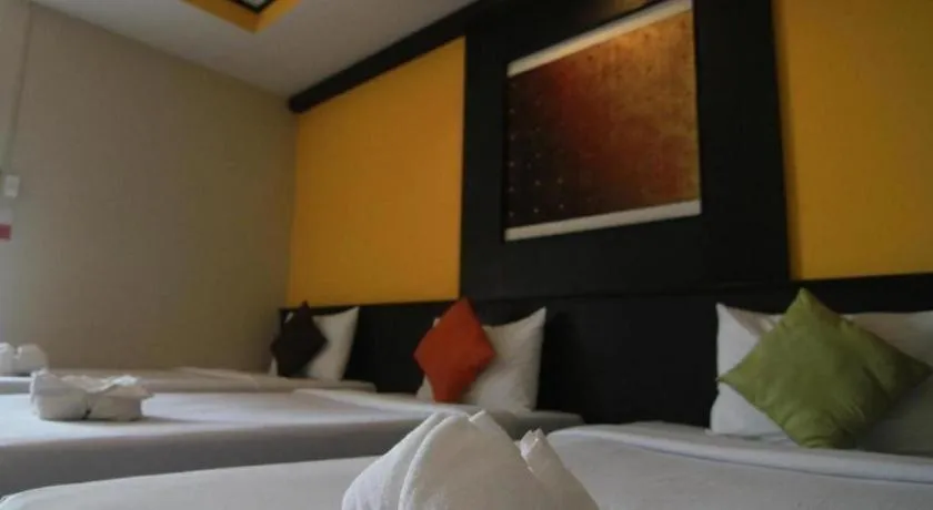 Bed in Grand Pinnacle Hotel