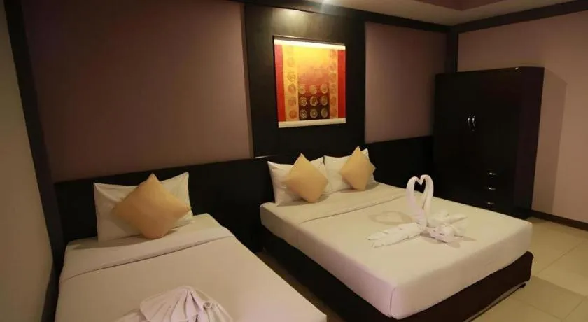Bed in Grand Pinnacle Hotel