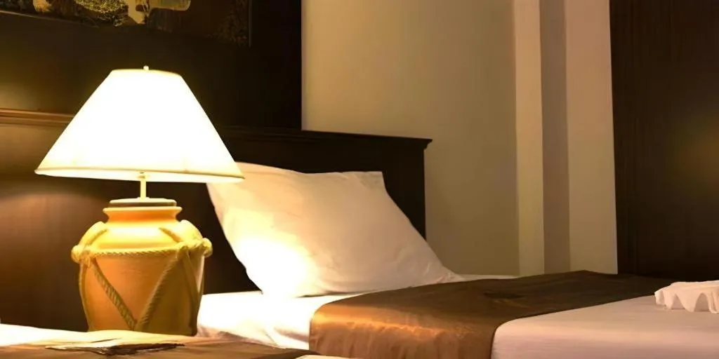 Bed in Grand Pinnacle Hotel