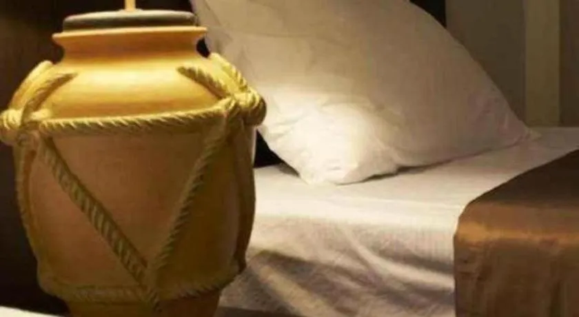 Bed in Grand Pinnacle Hotel