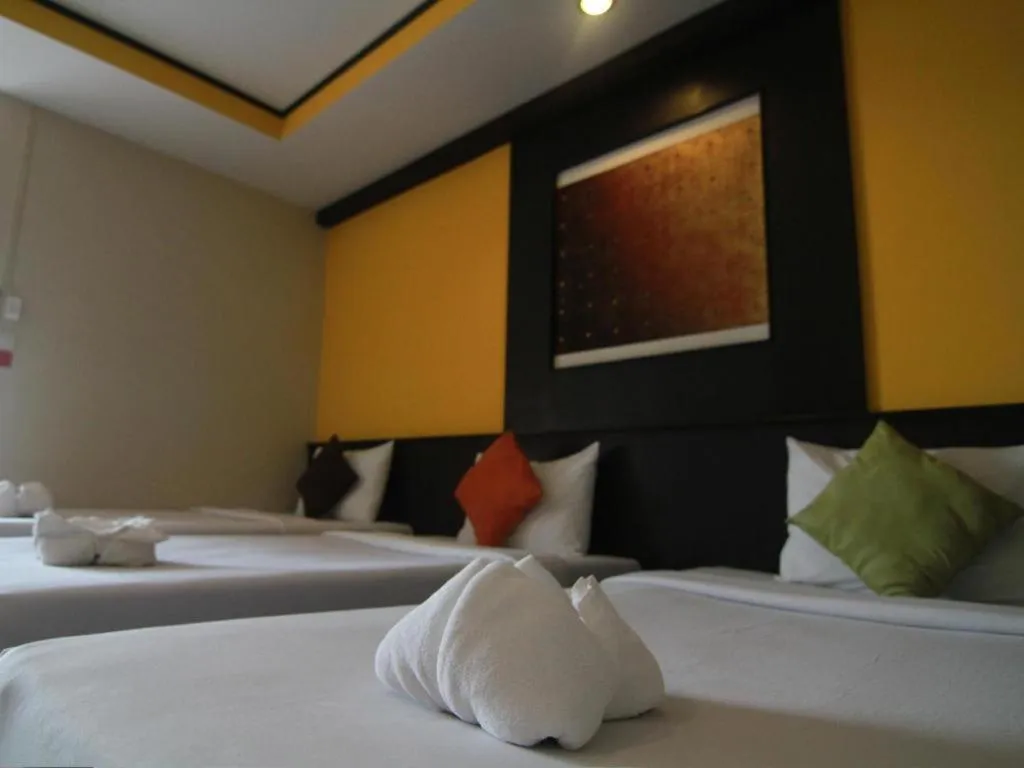 Bed in Grand Pinnacle Hotel