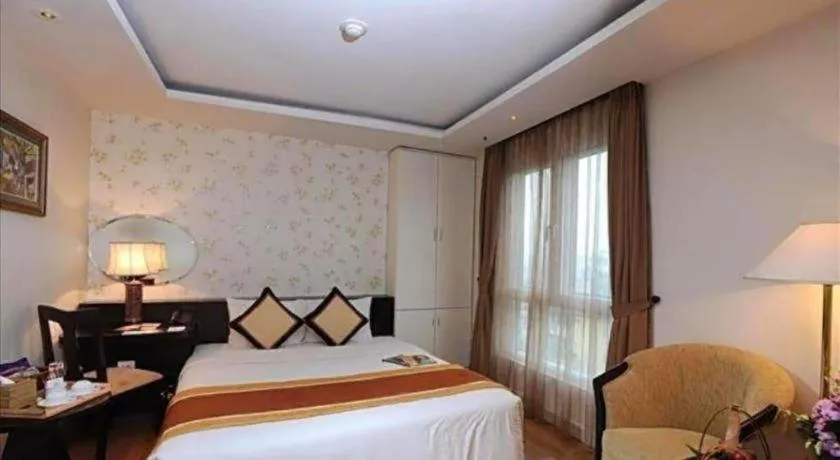 Bed in Cosiana Hotel