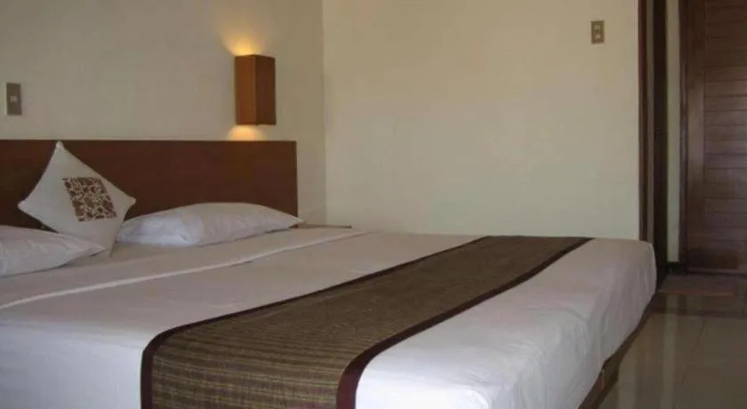 Bed in Nyiur Resort Hotel