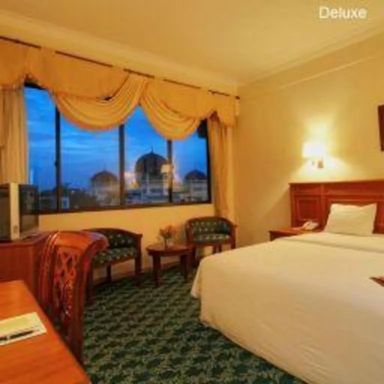 Bed in Madani Hotel Medan