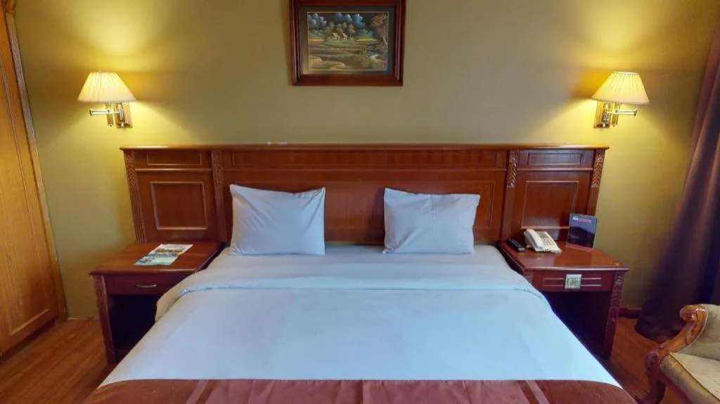 Bed in Madani Hotel Medan