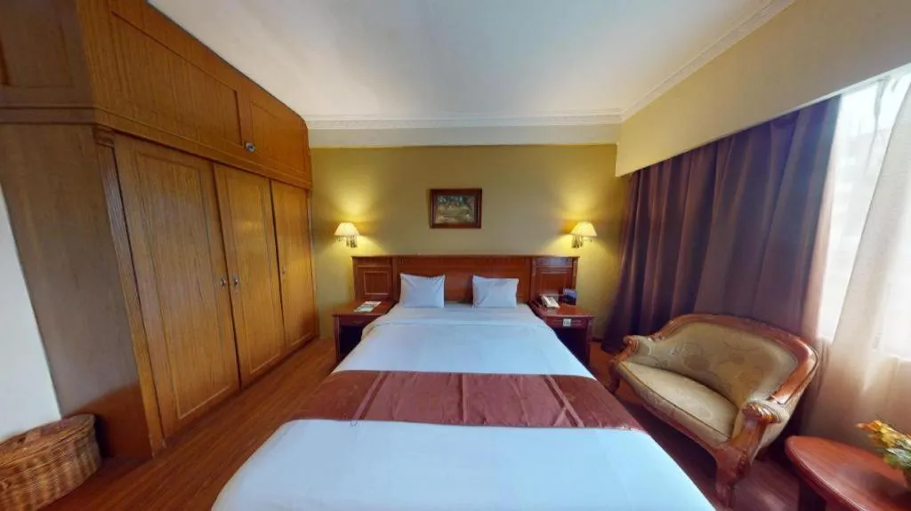 Bed in Madani Hotel Medan