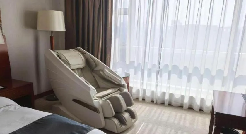 Bed in New Century Grand Hotel Ninghai Jinhai