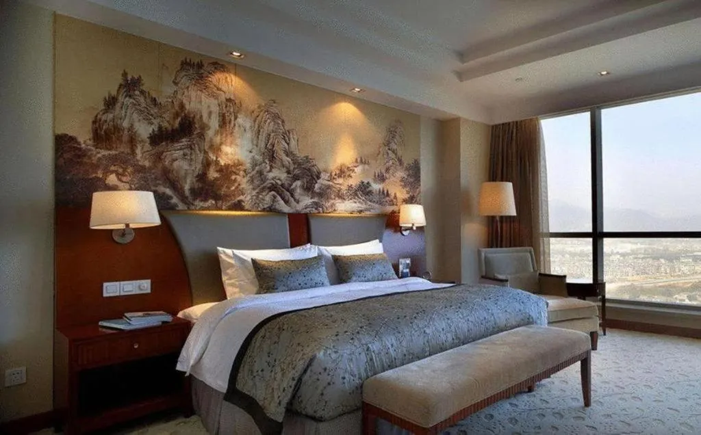 Bed in New Century Grand Hotel Ninghai Jinhai