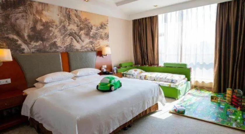 Bed in New Century Grand Hotel Ninghai Jinhai