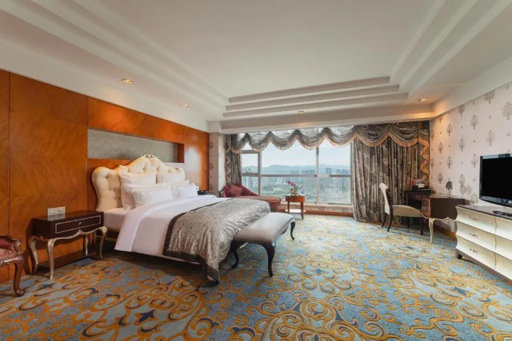 Bed in New Century Grand Hotel Ninghai Jinhai