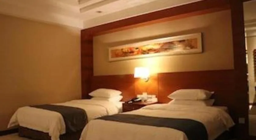 Bed in New Century Grand Hotel Ninghai Jinhai