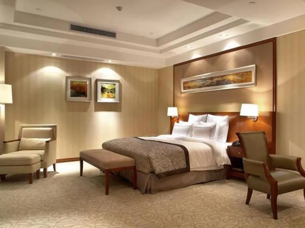 Bed in New Century Grand Hotel Ninghai Jinhai