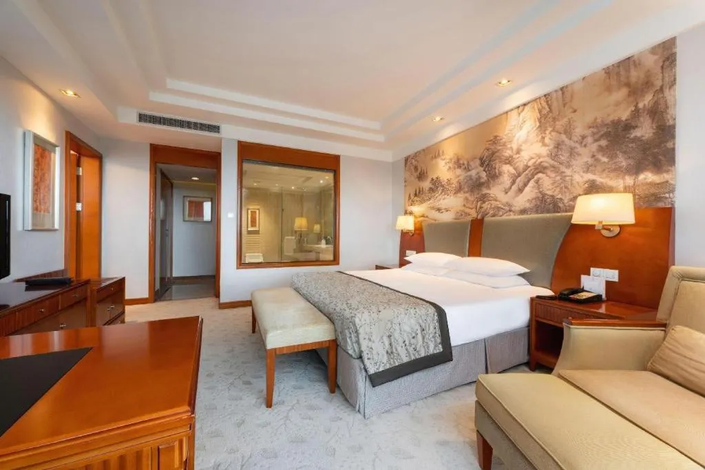 Bed in New Century Grand Hotel Ninghai Jinhai