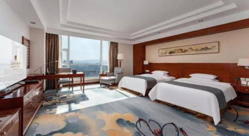 Bed in New Century Grand Hotel Ninghai Jinhai
