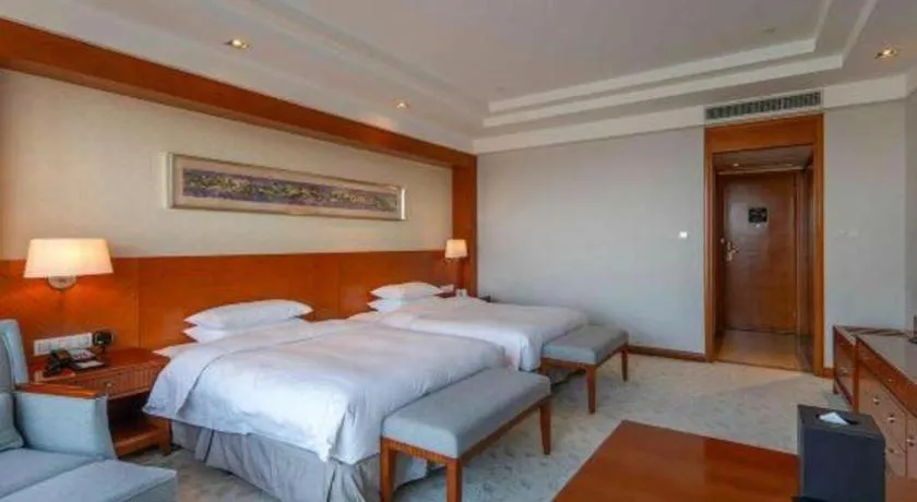 Bed in New Century Grand Hotel Ninghai Jinhai