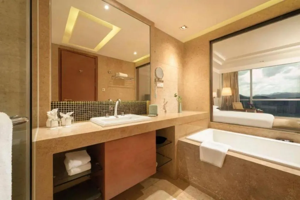 Bed in New Century Grand Hotel Ninghai Jinhai