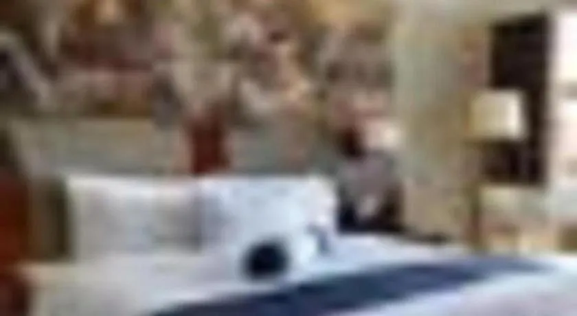 Bed in New Century Grand Hotel Ninghai Jinhai