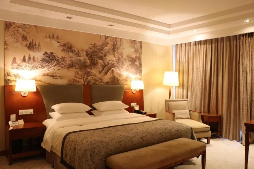 Bed in New Century Grand Hotel Ninghai Jinhai