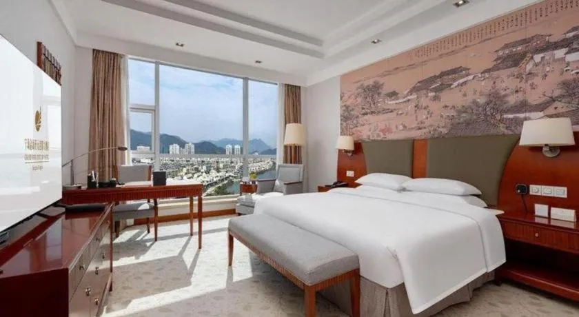 Bed in New Century Grand Hotel Ninghai Jinhai