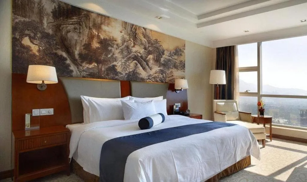Bed in New Century Grand Hotel Ninghai Jinhai