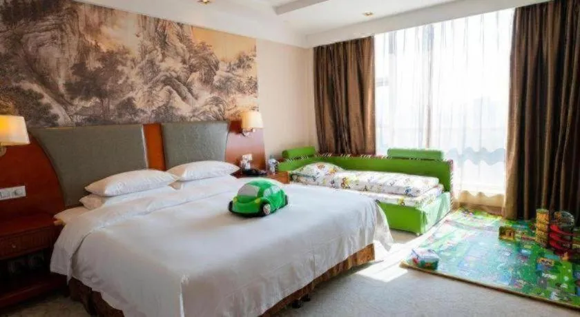 Bed in New Century Grand Hotel Ninghai Jinhai