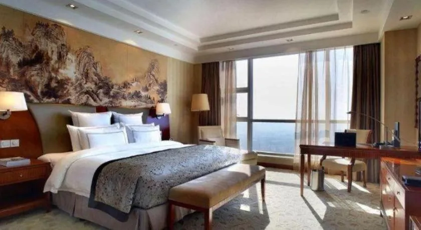 Bed in New Century Grand Hotel Ninghai Jinhai