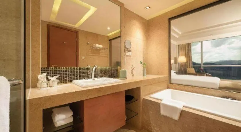 Bed in New Century Grand Hotel Ninghai Jinhai