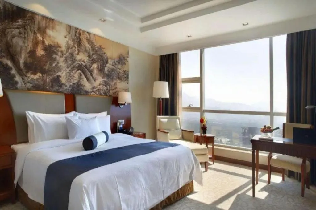 Bed in New Century Grand Hotel Ninghai Jinhai