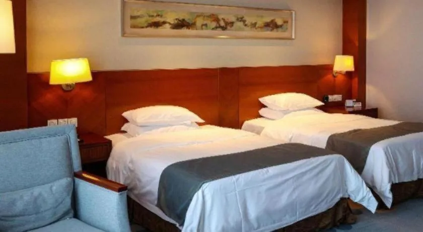 Bed in New Century Grand Hotel Ninghai Jinhai