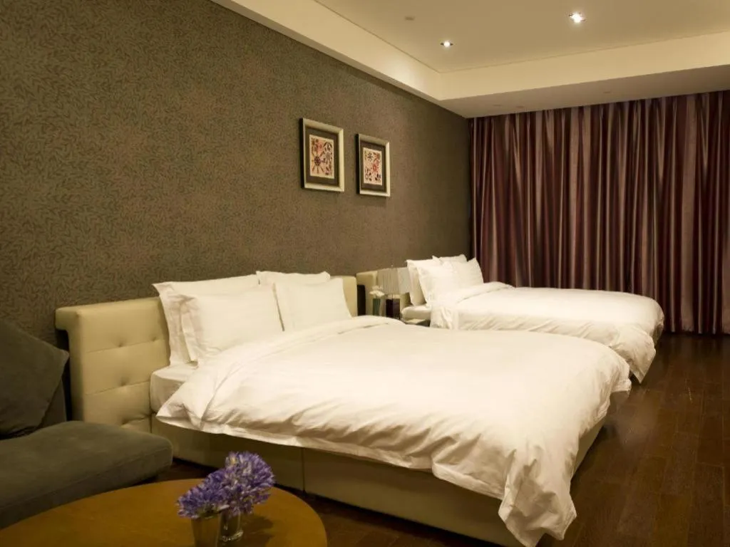 Bed in Grand Madison Qingdao Harbour-view Central（Former Qingdao Farglory Hotel）